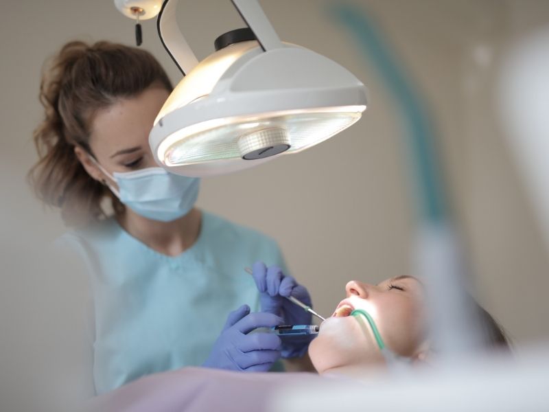 dentist treating teeth of a patient