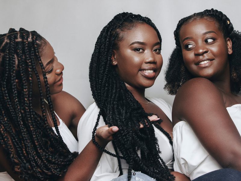 3 beautiful girls with neatly styled braids